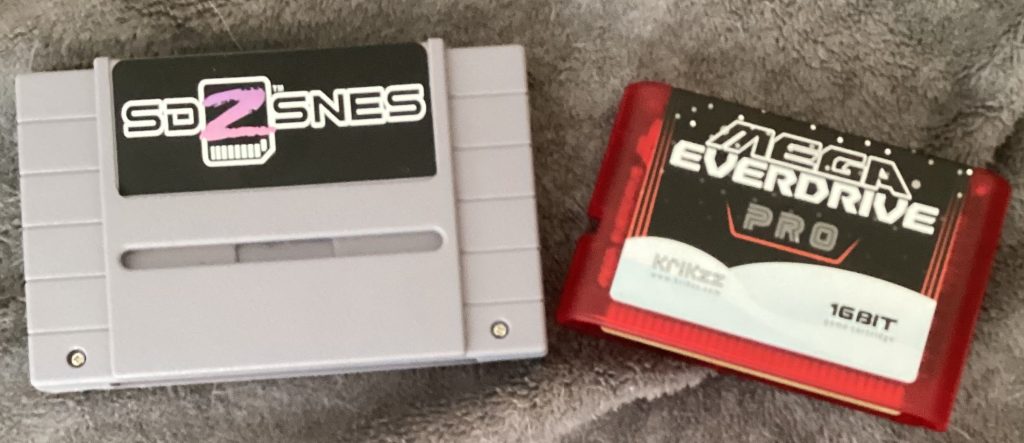 Two flash carts: SD2SNES used for Super Nintendo, and Mega Everdrive Pro, used for Sega Genesis